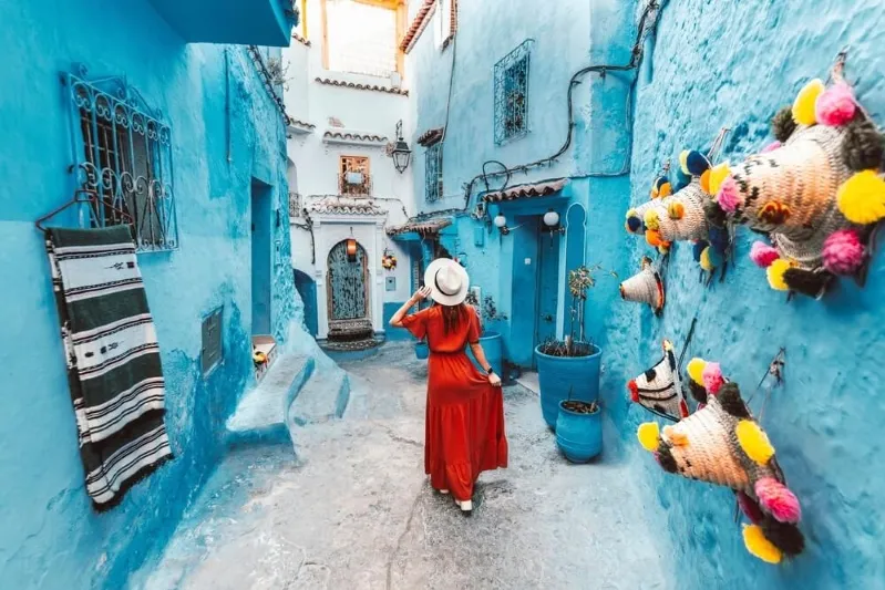 Scenic view of Chefchaouen, Morocco, showcasing its iconic blue buildings and mountainous backdrop.