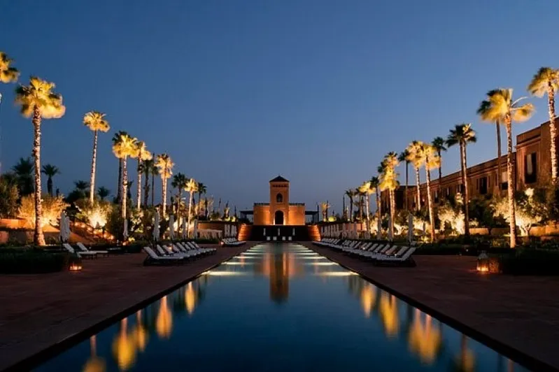 A luxurious hotel in Marrakech, Morocco, showcasing vibrant architecture and inviting ambiance for travelers. 