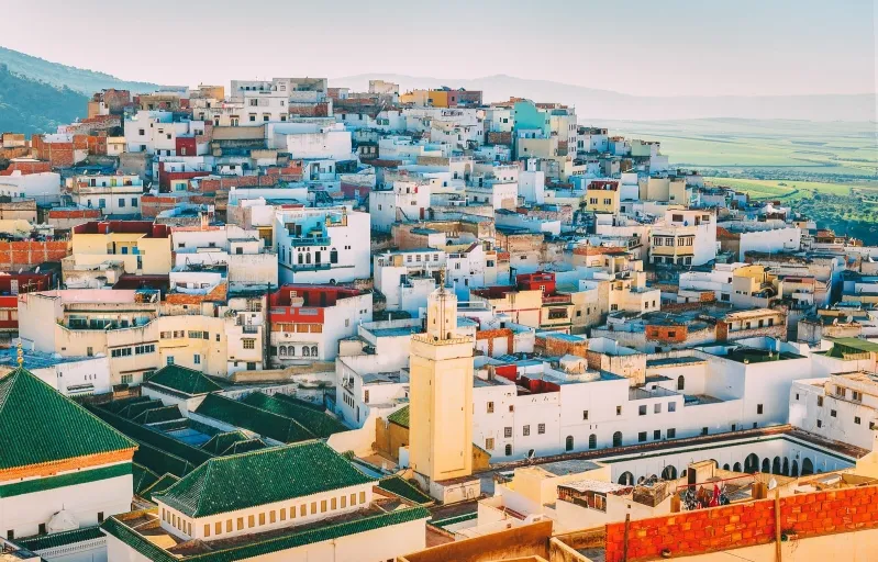A picturesque scene of Marrakech, Morocco, featuring its iconic buildings and offering insights on what to pack for morocco.