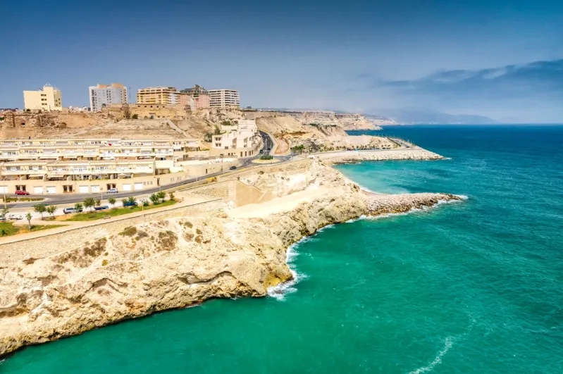A scenic view of the Algerian coast, showcasing the shoreline under clear skies typical of Morocco weather. 