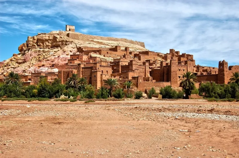 A panoramic view of the city of Fes, Morocco, set against the backdrop of the vast desert landscape.