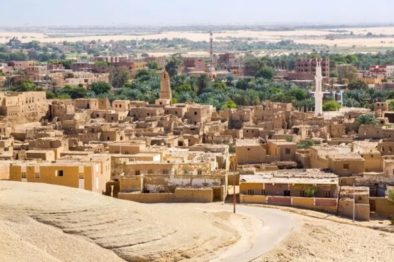 A panoramic view of Sahara city, showcasing its vibrant architecture amidst the vast desert landscape of Morocco.