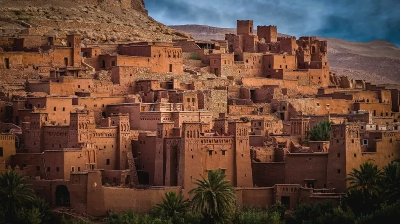  A picturesque view of a Moroccan city perched atop a hill, showcasing its unique architecture and scenic landscape.