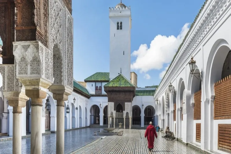 A serene courtyard of a Marrakech mosque, showcasing intricate architecture, ideal for travelers on Morocco tours from USA.