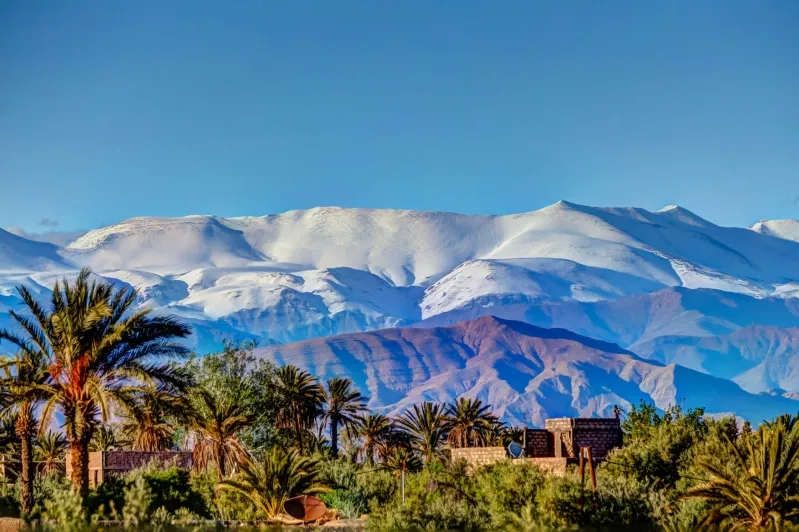 Snow-capped Atlas Mountains in Morocco, showcasing stunning peaks ideal for Atlas Mountains trekking tours and outdoor adventures. 