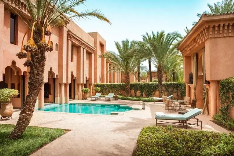 A picturesque pool at a Marrakech riad, inviting relaxation amidst the luxury of Morocco's desert tours.
