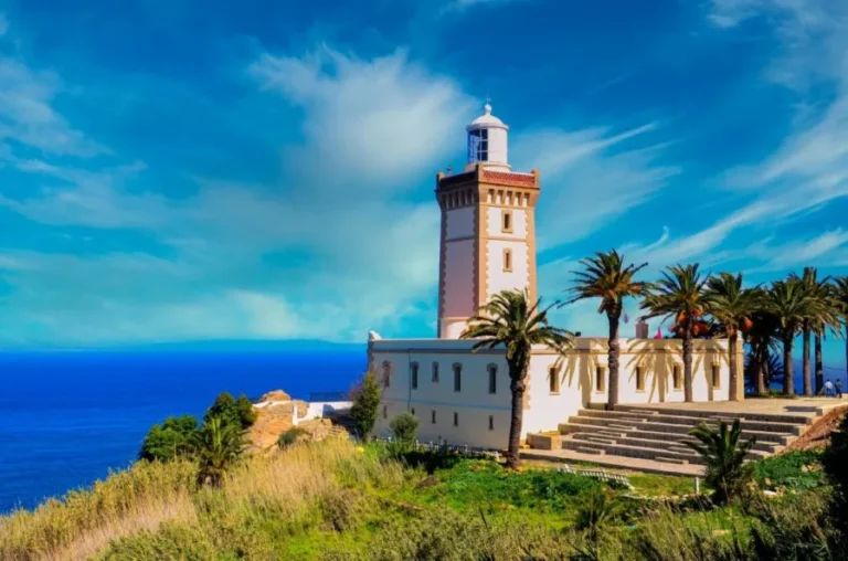 A stunning lighthouse overlooking the coast of Morocco, representing the allure of Moroccan travel experiences.