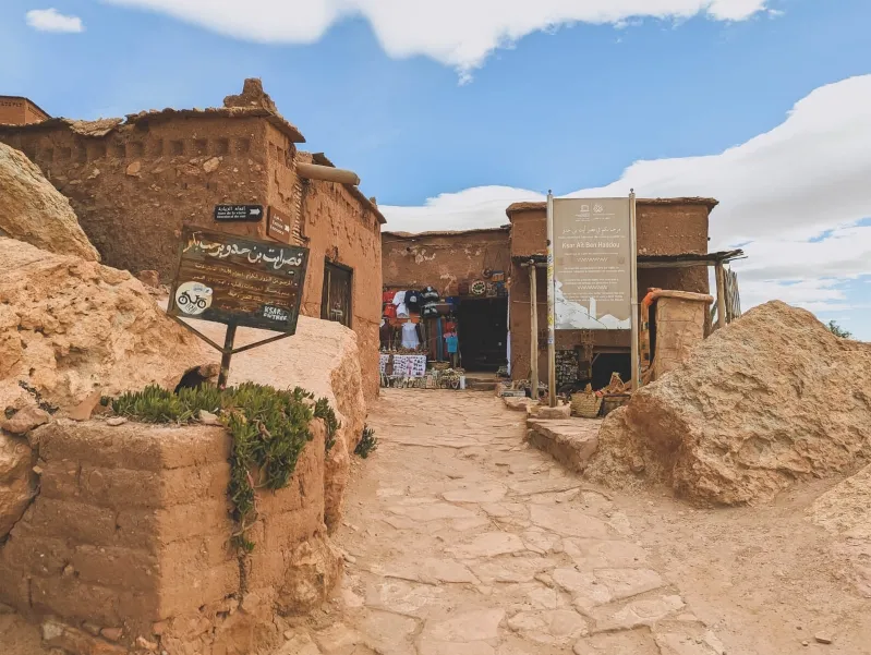 A haunting view of the House of the Dead in Morocco, showcasing its eerie architecture amidst a travel package backdrop.