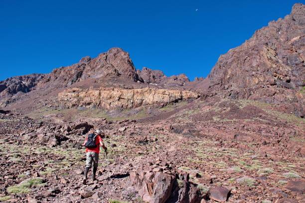 Hikers exploring the Atlas Mountains in Morocco on a guided trekking tour through Amazigh villages and mountain trails