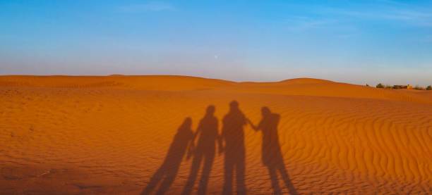 Family enjoying a private Morocco tour with children exploring the Sahara Desert, camel rides, imperial cities, and cultural attractions