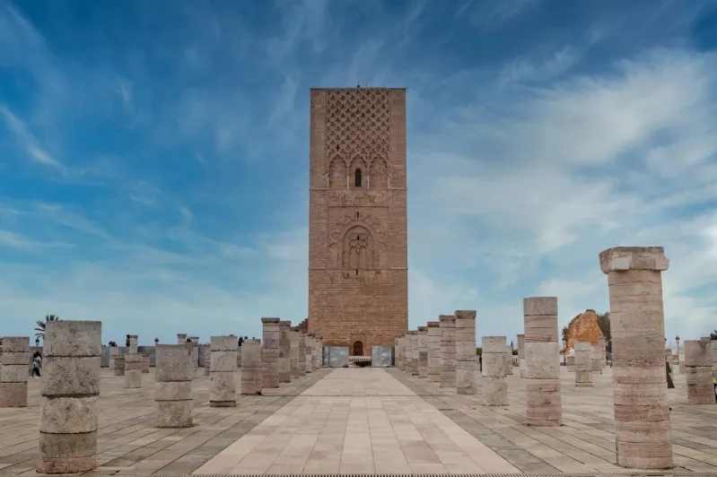 Tower of a mosque in Morocco, showcasing intricate architecture, a popular travel destination for visitors exploring the country. 