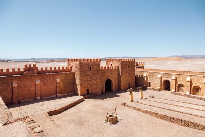 The majestic Moroccan castle rises in the desert landscape, a highlight of Ouarzazate's sightseeing attractions.