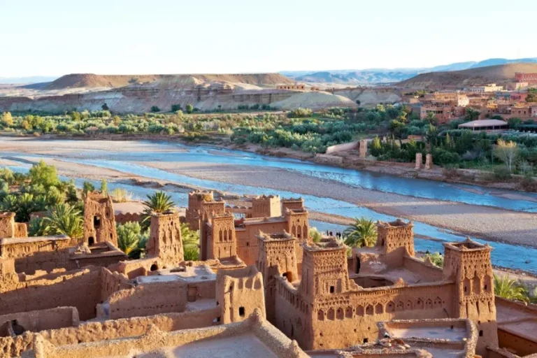 Red cliffs of the Atlas Mountains in Morocco, showcasing the stunning landscape near Ouarzazate, a must-visit destination.