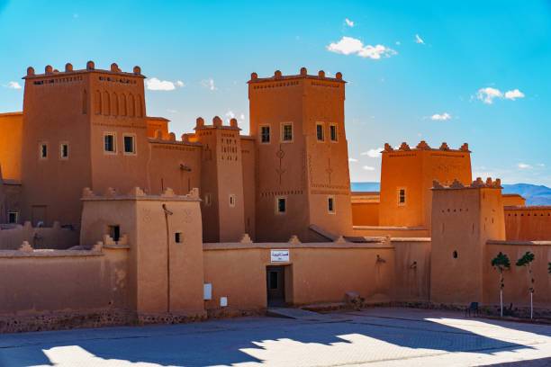 The Kasbah Taourirt in Ouarzazate Morocco showing traditional earthen architecture, desert surroundings, and historic fortress walls