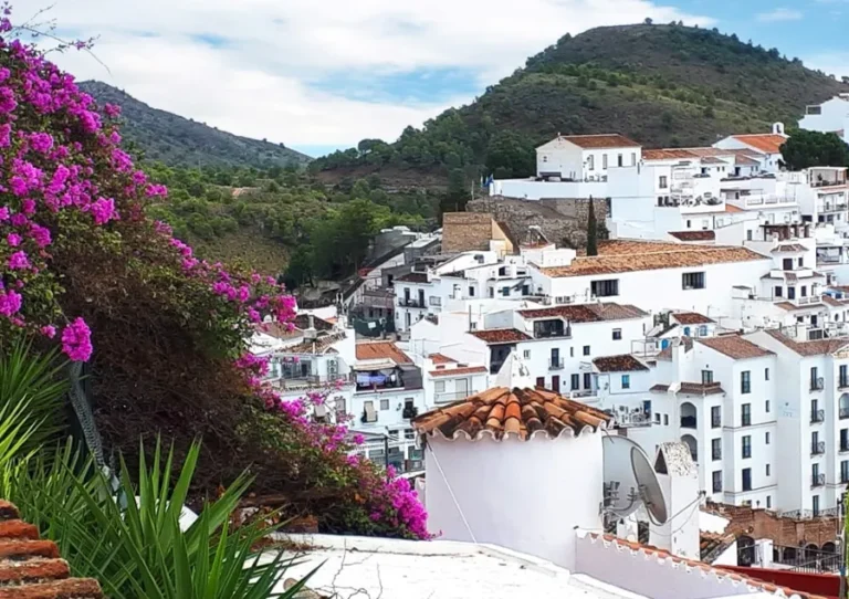 A panoramic view of Alcudia, Spain, showcasing its charming architecture and coastal scenery.