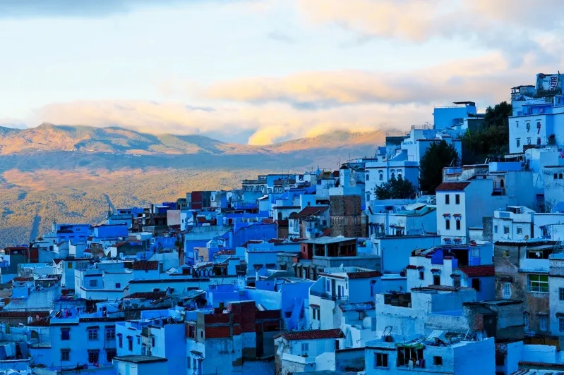 Vibrant blue streets of Chefchaouen, Morocco, highlighting the city's charm for all-inclusive vacation packages. 