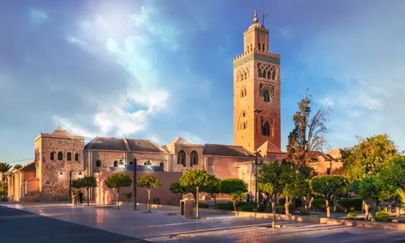 A panoramic view of Marrakech, Morocco, showcasing its vibrant architecture and bustling streets, a top vacation destination. 