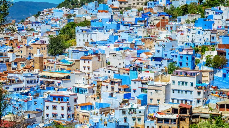Scenic view of Chefchaouen, Morocco, showcasing its iconic blue buildings, perfect for travelers exploring Morocco tour packages.