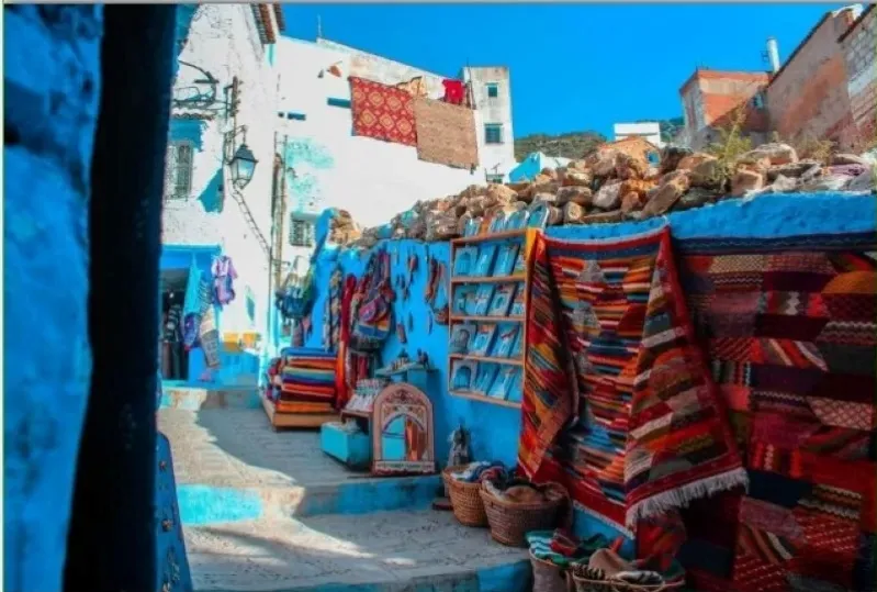 Scenic view of Chefchaouen, Morocco, showcasing its iconic blue buildings, ideal for small group tours to morocco. 