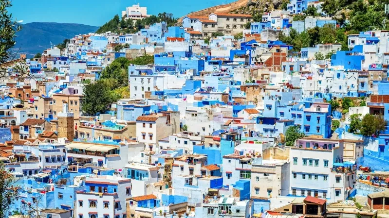 Scenic view of Chefchaouen, Morocco, showcasing its iconic blue buildings, a top vacation spot in the country.