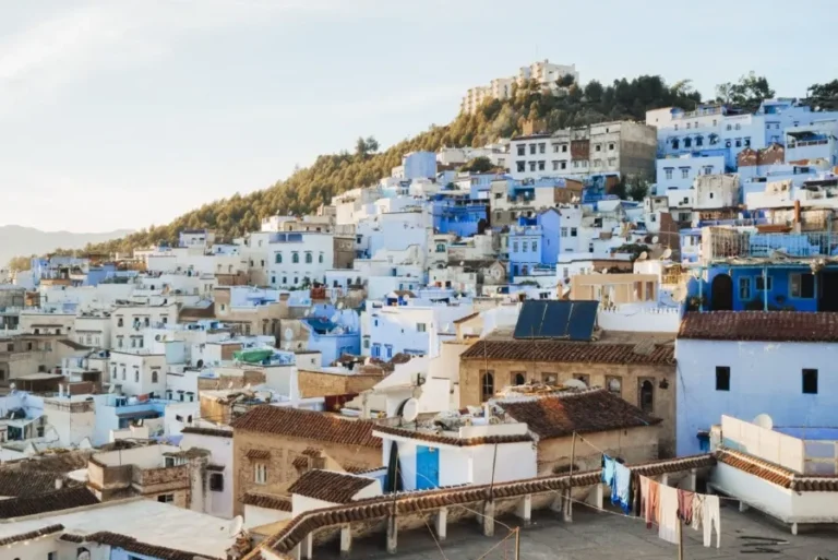 Scenic view of Chefchaouen, Morocco, showcasing its iconic blue buildings, popular among tour groups exploring the region.