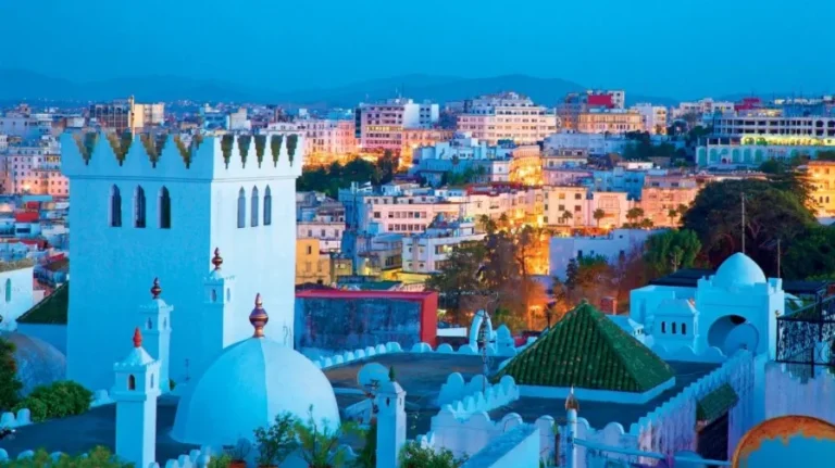 Night view of Tangier, Morocco, showcasing illuminated buildings and streets, highlighting the city's vibrant atmosphere.