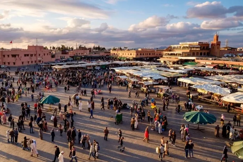 A panoramic view of Marrakech, Morocco Travel Guide, showcasing its vibrant architecture and bustling streets. 