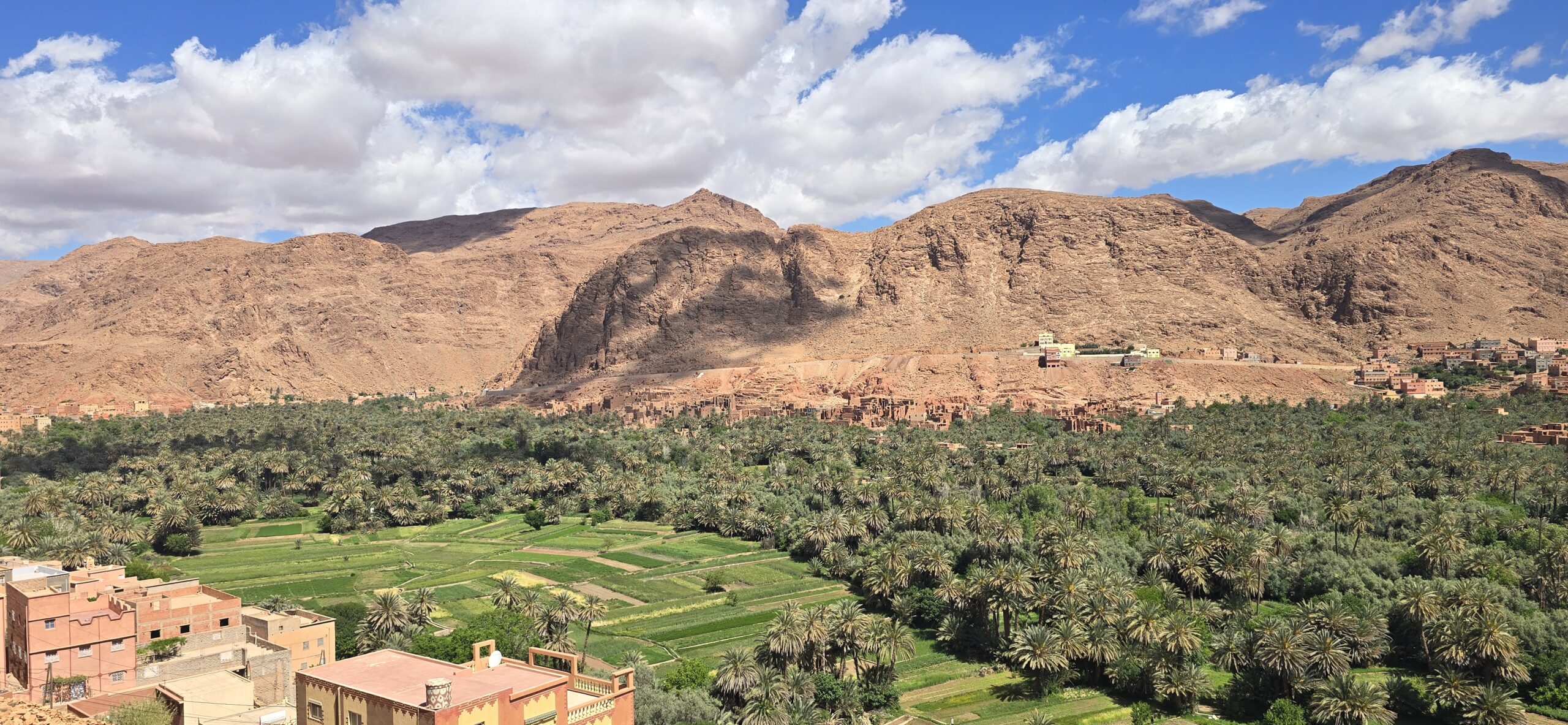 7 days Morocco tour from Tangier featuring Chefchaouen blue city, Fes medina, Sahara Desert camel trekking, Atlas Mountains, and kasbah landscapes