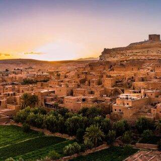 Ait Ben Haddou kasbah in Morocco showing ancient clay fortress village on hill in desert landscape
