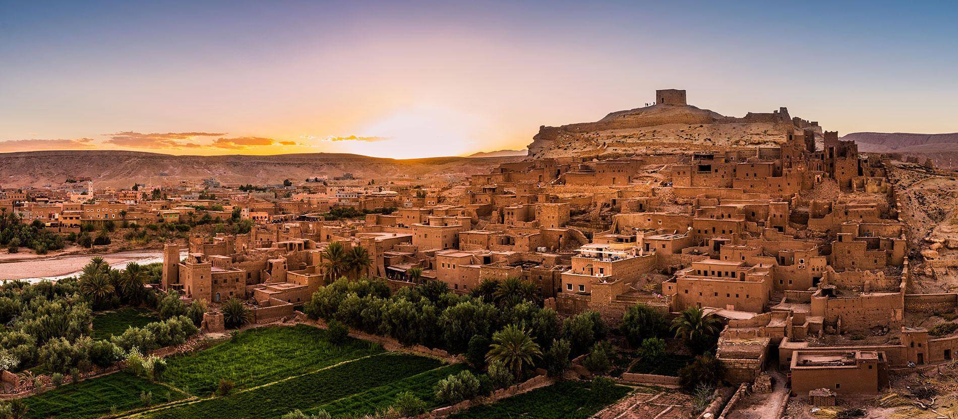 Ait Ben Haddou kasbah in Morocco showing ancient clay fortress village on hill in desert landscape