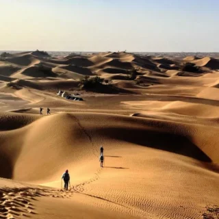 Morocco Sahara Desert featuring Erg Chebbi dunes, camel trekking, luxury desert camps, sunset views, and desert landscapes near Merzouga