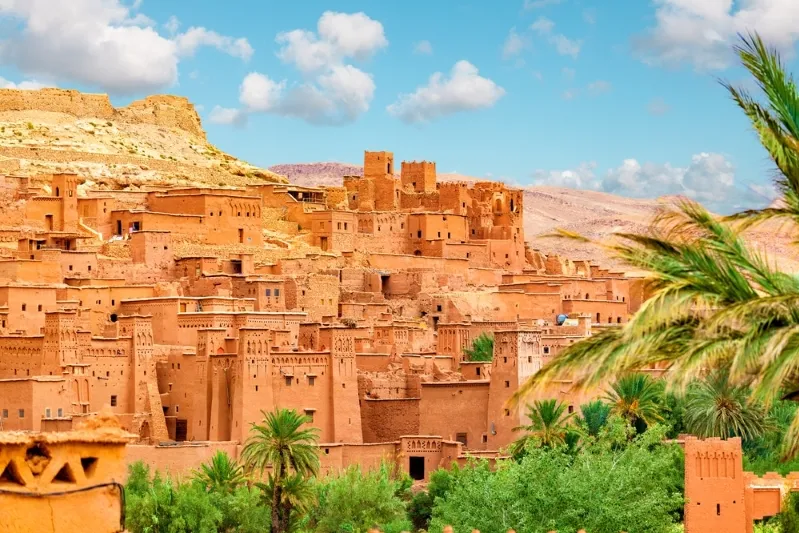 Hikers trekking through the Atlas Mountains and Sahara Desert in Morocco, exploring scenic trails, Berber villages, and breathtaking landscapes