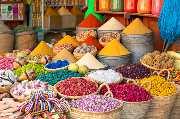 Travelers on Morocco tour from Hong Kong exploring Sahara Desert dunes, camel trekking, Marrakech, Fes, and Atlas Mountains